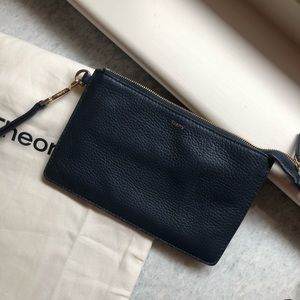 Theory clutch. Navy leather